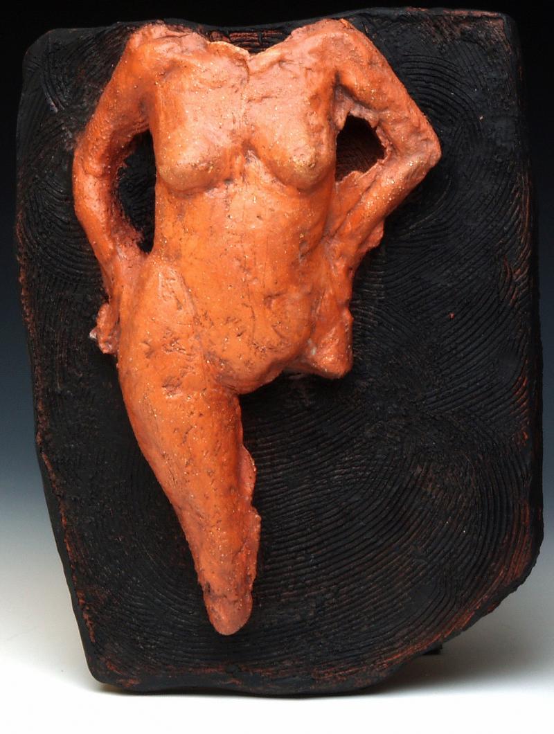 Ceramic figure on wood